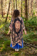 Woman in a patterned kimono walking through a forest