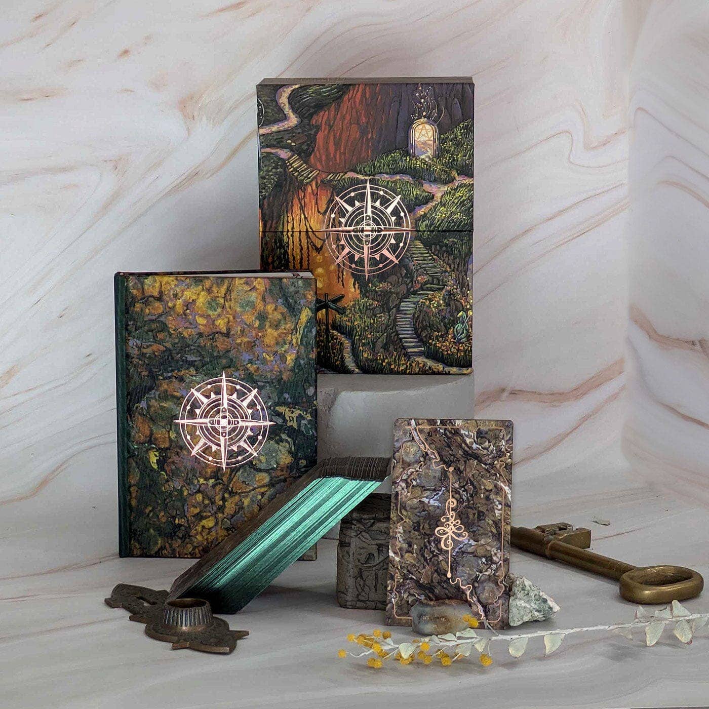 Decorative boxes with compass design on a marble surface