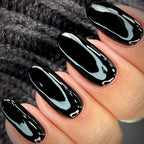 Close-up of a hand with black glossy nail polish on a textured gray background