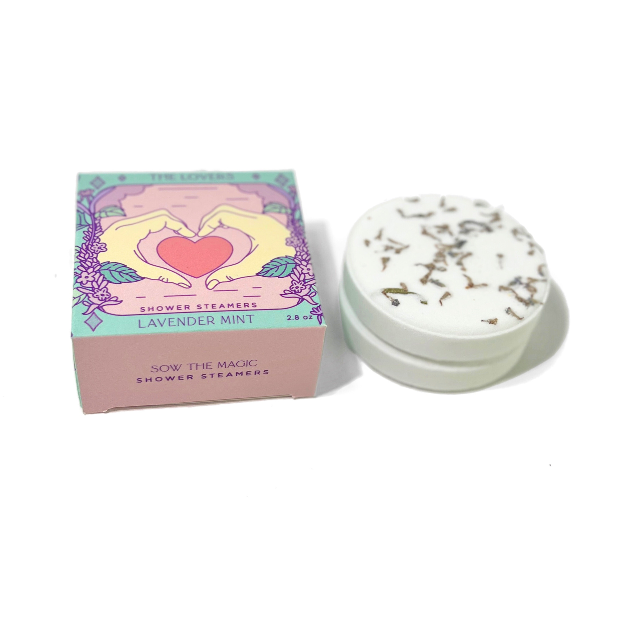 Lavender mint shower steamers with packaging on a white background
