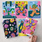 Colorful children's books with cartoon characters on a light gray background
