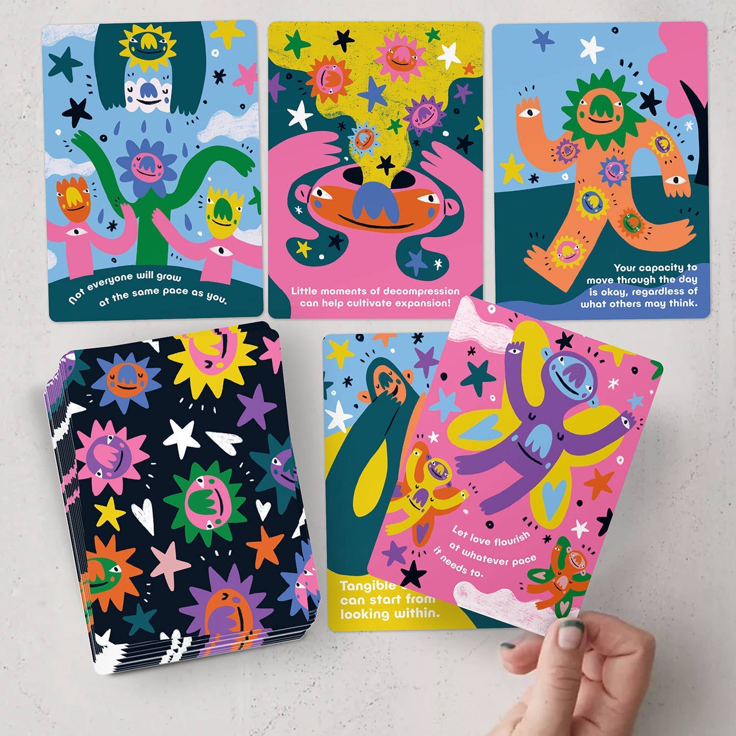 Colorful children's books with cartoon characters on a light gray background