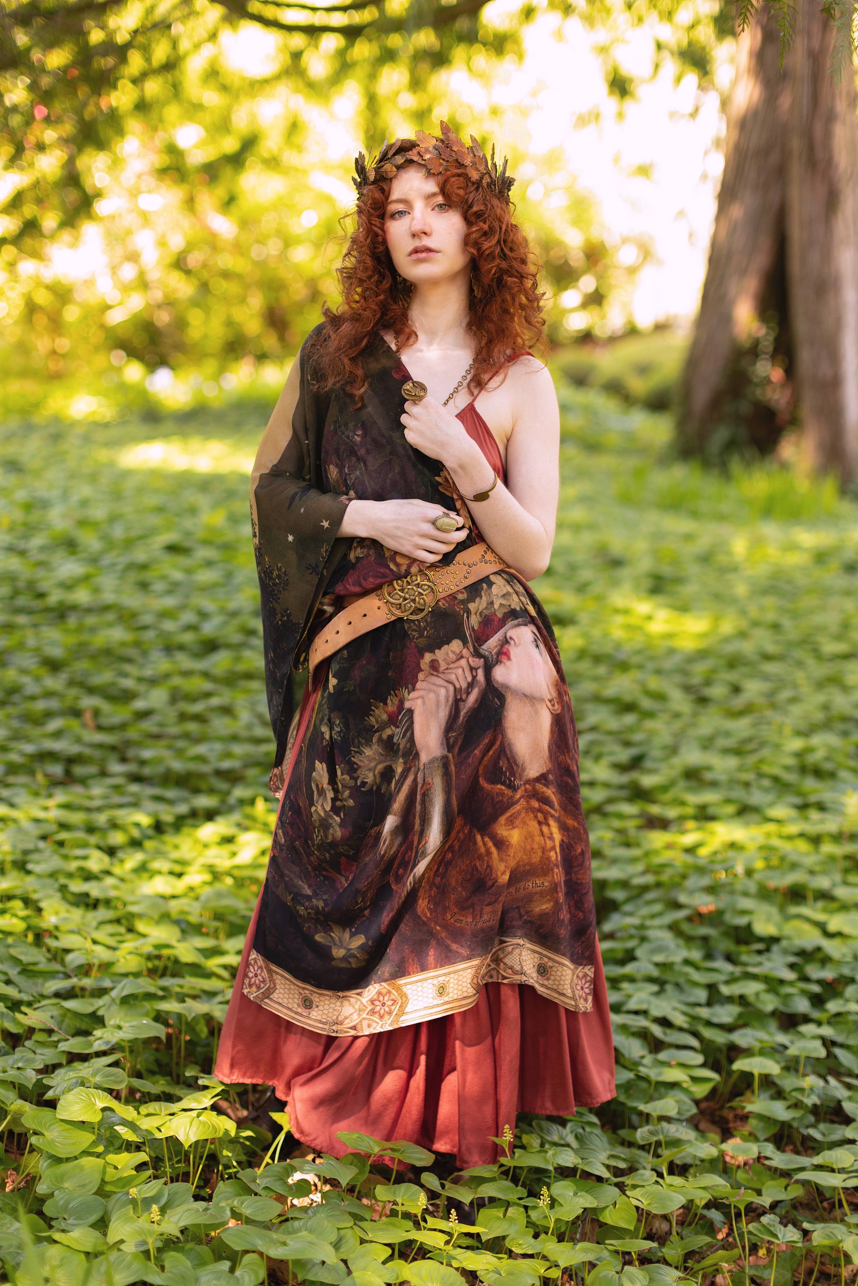Woman in a fantasy dress standing in a forest