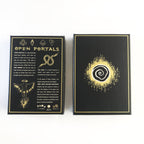 Black and gold card game box with 'Open Portals' text and symbol on a white background
