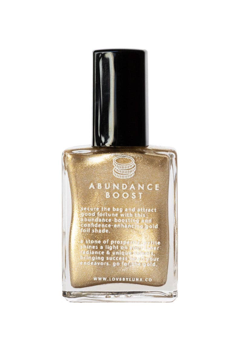 Gold bottle labeled 'Abundance Boost' on a white background