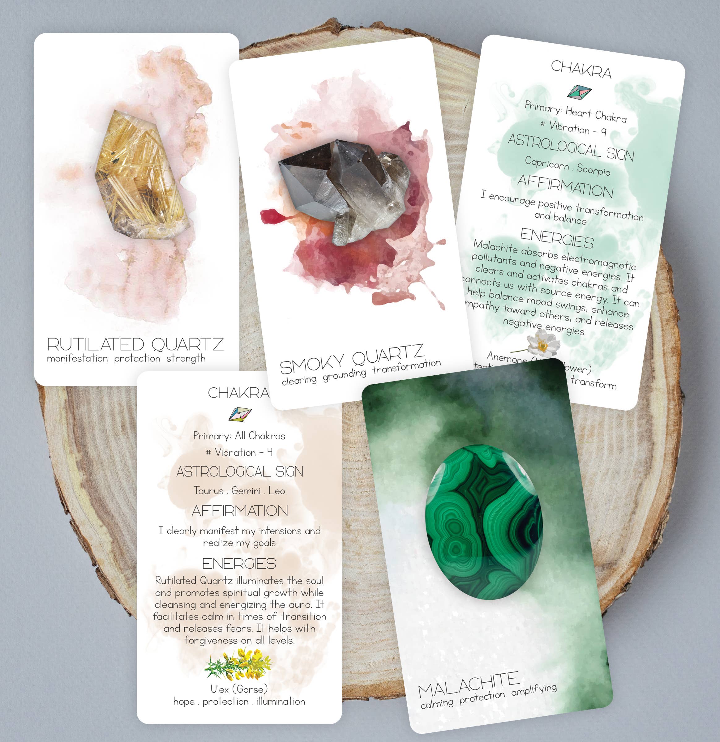 Set of tarot cards with gemstones on a wooden surface