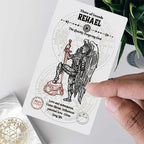 Card featuring an angel with a sword, held by a hand on a light background.