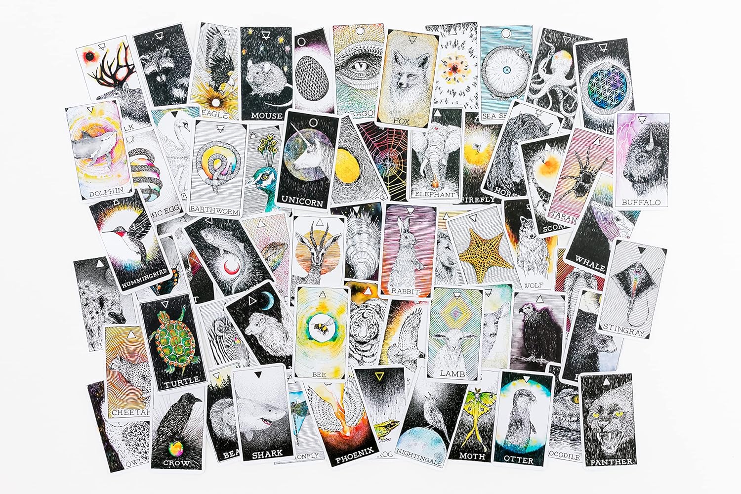 Collection of tarot cards with various designs on a white background
