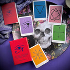 Oracle cards with symbolic designs on a colorful background