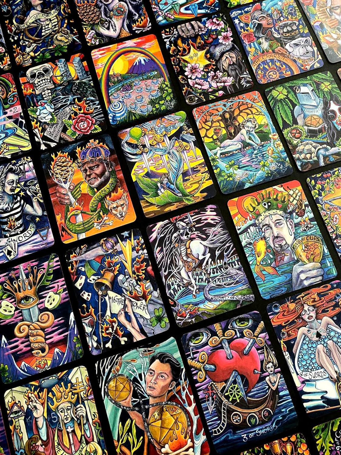 Collection of colorful tarot cards with various designs and illustrations.