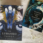 Two tarot card books by E. Lubanko on a textured surface
