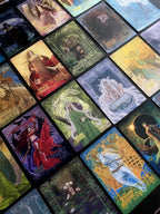 Collection of tarot cards with various artistic designs.