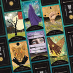 Collection of tarot cards with various symbols and designs on a dark background