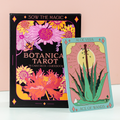 Botanica Tarot book and a tarot card featuring an aloe vera plant on a light pink background.