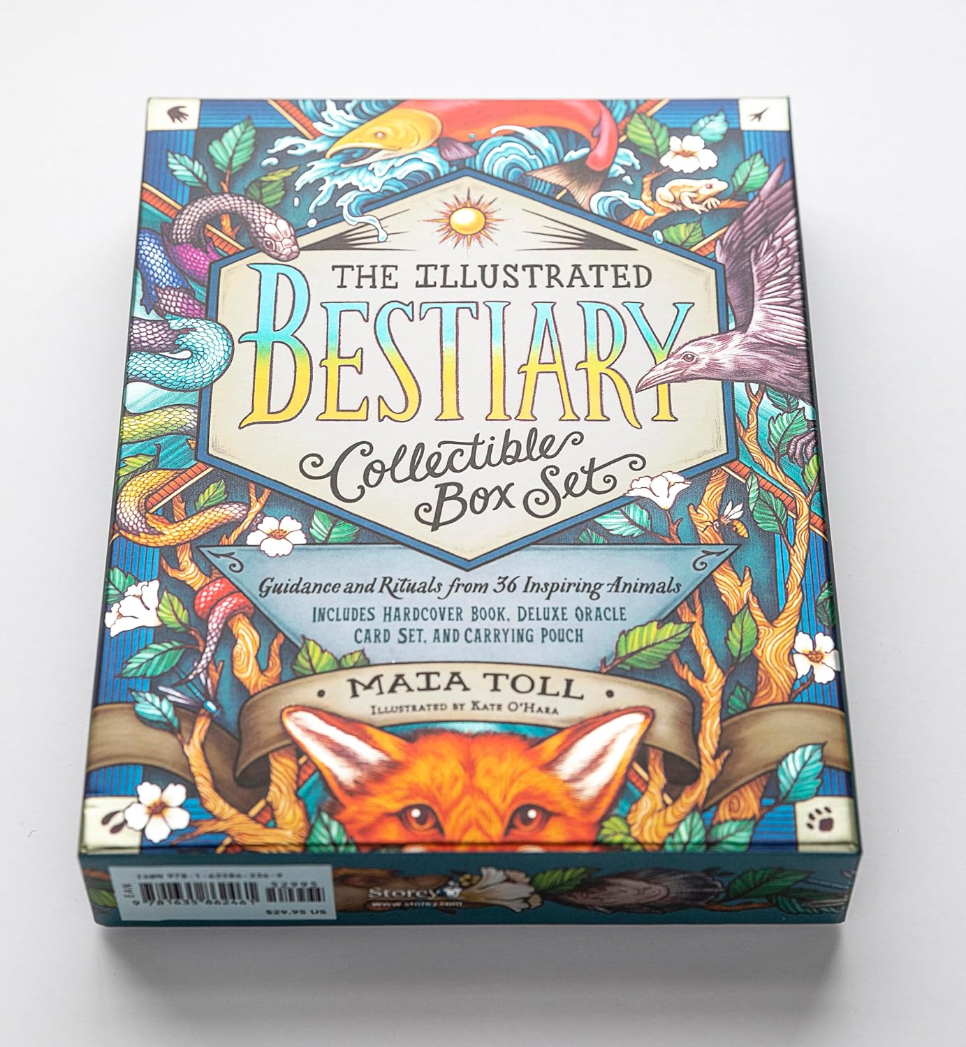 The Illustrated Bestiary Collectible Box Set by Mata Toll, featuring a highly detailed, colorful cover illustration with a fox, bird, serpent, and floral motifs on a white background.