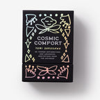 Black book titled 'Cosmic Comfort' by Yumi Sakugawa with decorative elements on a white background