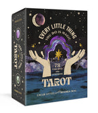 Tarot card set packaging with artistic design and text on a black background