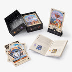Set of tarot cards with card holders and an open book on a white background