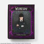 Ornate packaging for 'Wednesday' The Official Oracle Deck with a character illustration on a white background.
