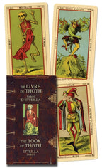 Tarot cards with a dark brown leather-bound book titled 'Le Livre de Thoth' on a white background.