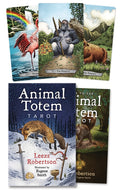 Collection of Animal Totem Tarot cards and book with illustrations of animals and nature scenes.
