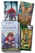 Tarot cards with fantasy designs and a book titled 'Tarot at the End of the Rainbow' on a white background.