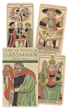 Four tarot cards from the Gassmann Tarot de Marseille set, featuring colorful illustrations of figures and symbols.