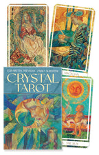 Crystal Tarot cards with colorful artwork and a book titled 'Crystal Tarot' by Elisabetta Trevisan and Fabio Albertini.