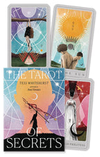 Four tarot cards with artistic illustrations and a book titled 'The Tarot of Secrets' by Tess Whitehurst.