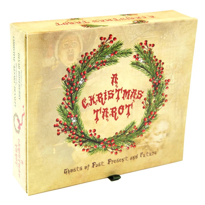 A vintage-style boxed tarot card deck titled "A Christmas Tarot" with a cream-colored cover, red berry wreath illustration, and gothic text reading "Ghosts of Past, Present, and Future.".