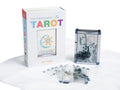 Transparent tarot cards with packaging on a white background