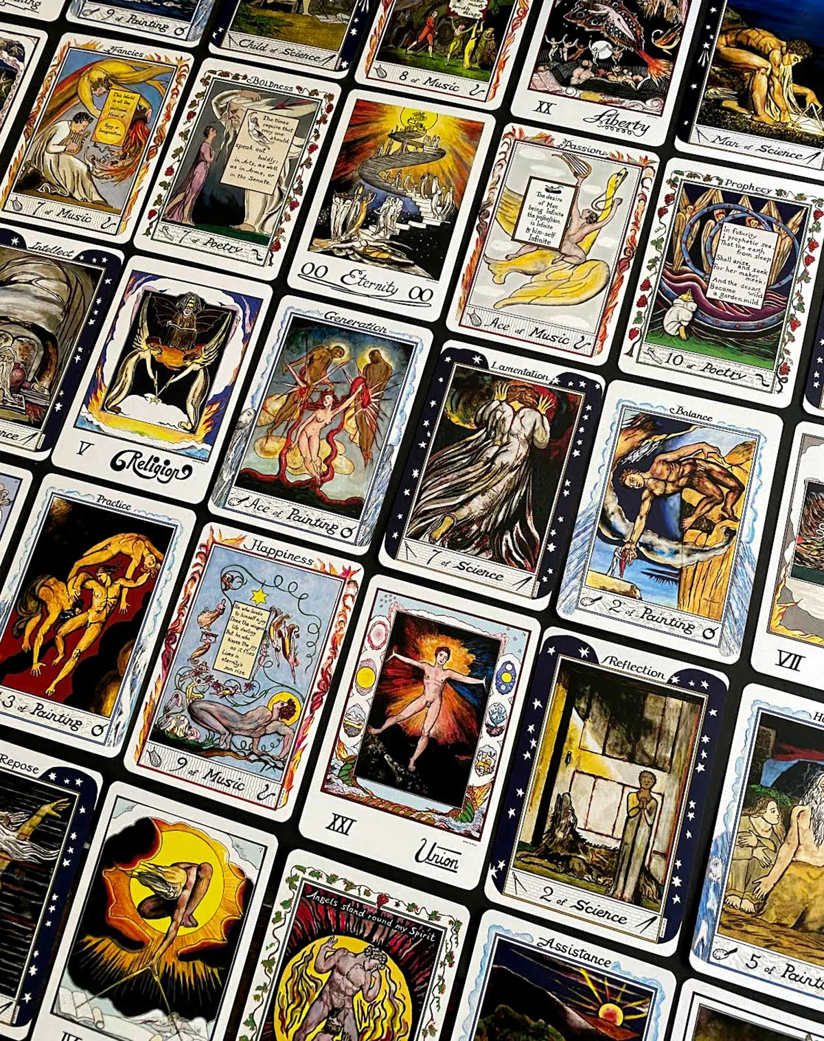 A close-up of a printed sheet or spread of illustrated tarot-style cards arranged in a grid. The cards feature fantasy and mythological scenes with figures, animals, and symbolic imagery, and the visible French card titles include Le Morte, Orphée, La Sagesse, and La Justice.