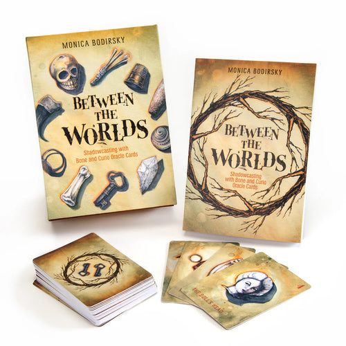 The Oracle and guide book for 'Between the Worlds' by Monica Bodirsky with cards on a white background