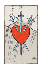 Tarot card with a red heart pierced by three blue swords, on a light gray background.