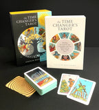 Time Changer's Tarot cards with book and cards on a dark background