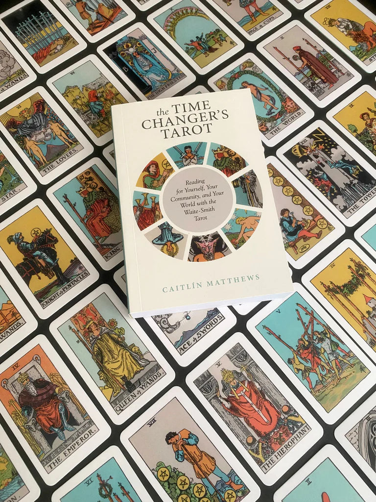 Book titled 'The Time Changer's Tarot' by Caitlin Matthews on a background of tarot cards.
