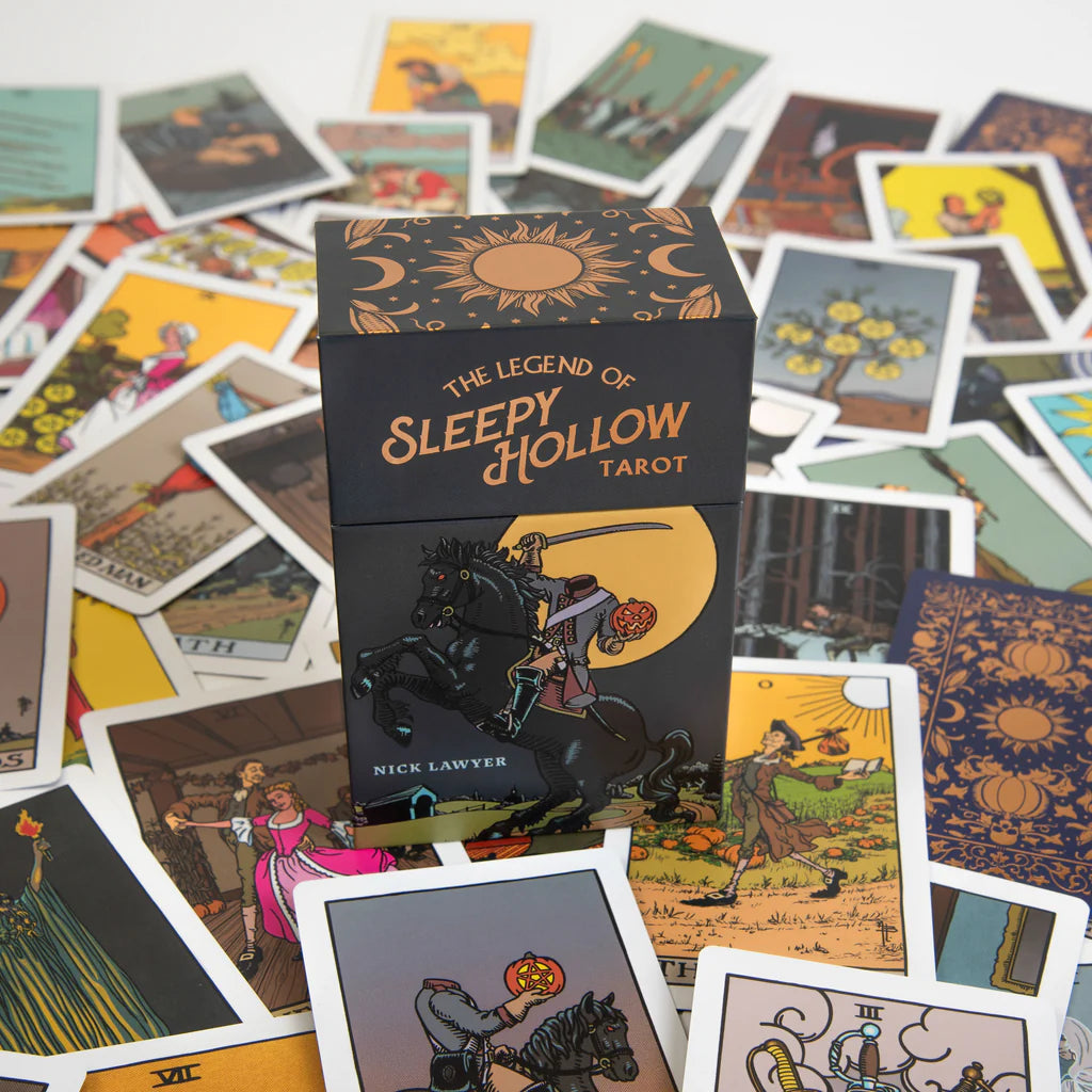 Sleepy Hollow tarot cards with deck box surrounded by tarot cards featuring illustrations.