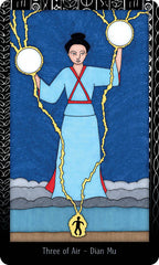 Card from a tarot deck featuring a figure holding two spheres with a blue background