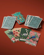 Set of playing cards with nature-themed designs on a red background