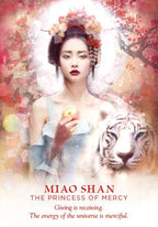 Woman holding an apple with a tiger and cherry blossoms in the background, featuring text about mercy and the energy of the universe.