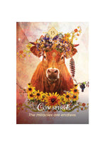 Poster with a cow wearing a flower crown and text 'Cow Spirit: The miracles are endless.'