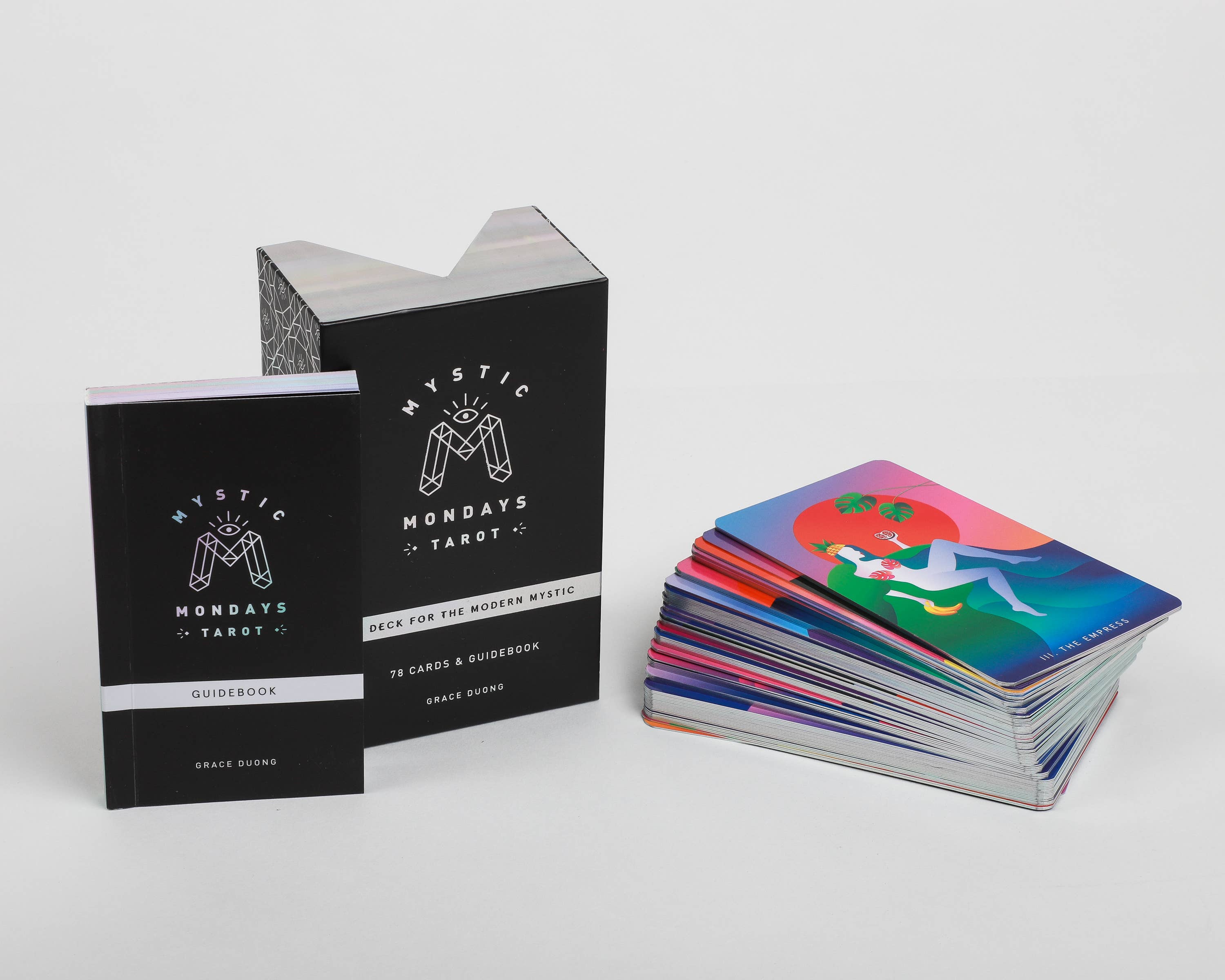 Mystic Mondays Tarot cards with two black books on a white background