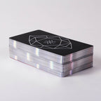 Stack of black cards with a geometric design on a white background