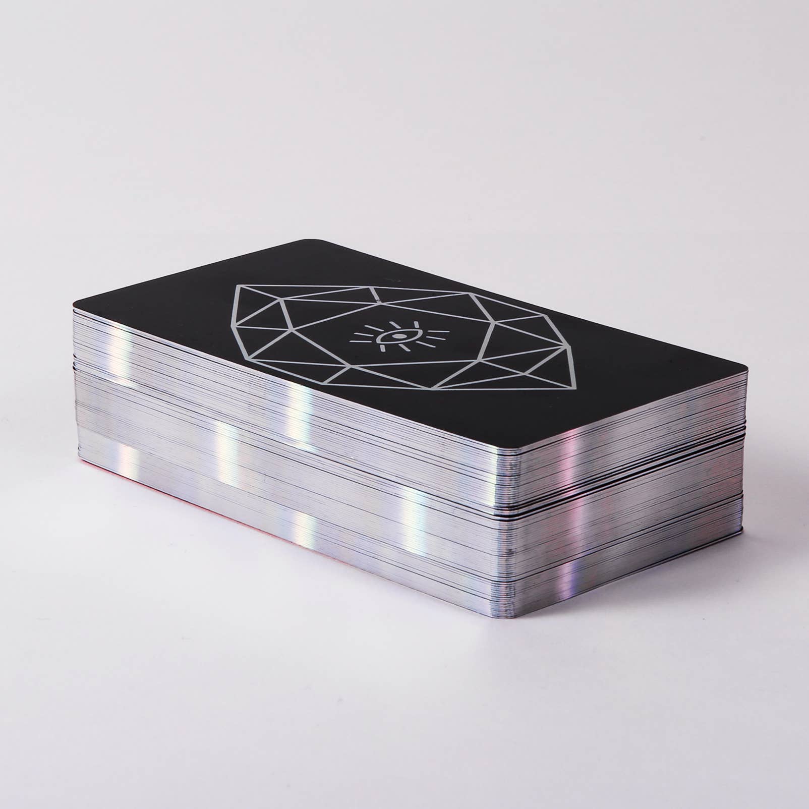 Stack of black cards with a geometric design on a white background
