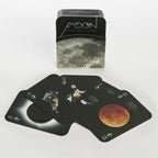 Moon-themed playing cards with a tin box on a white background