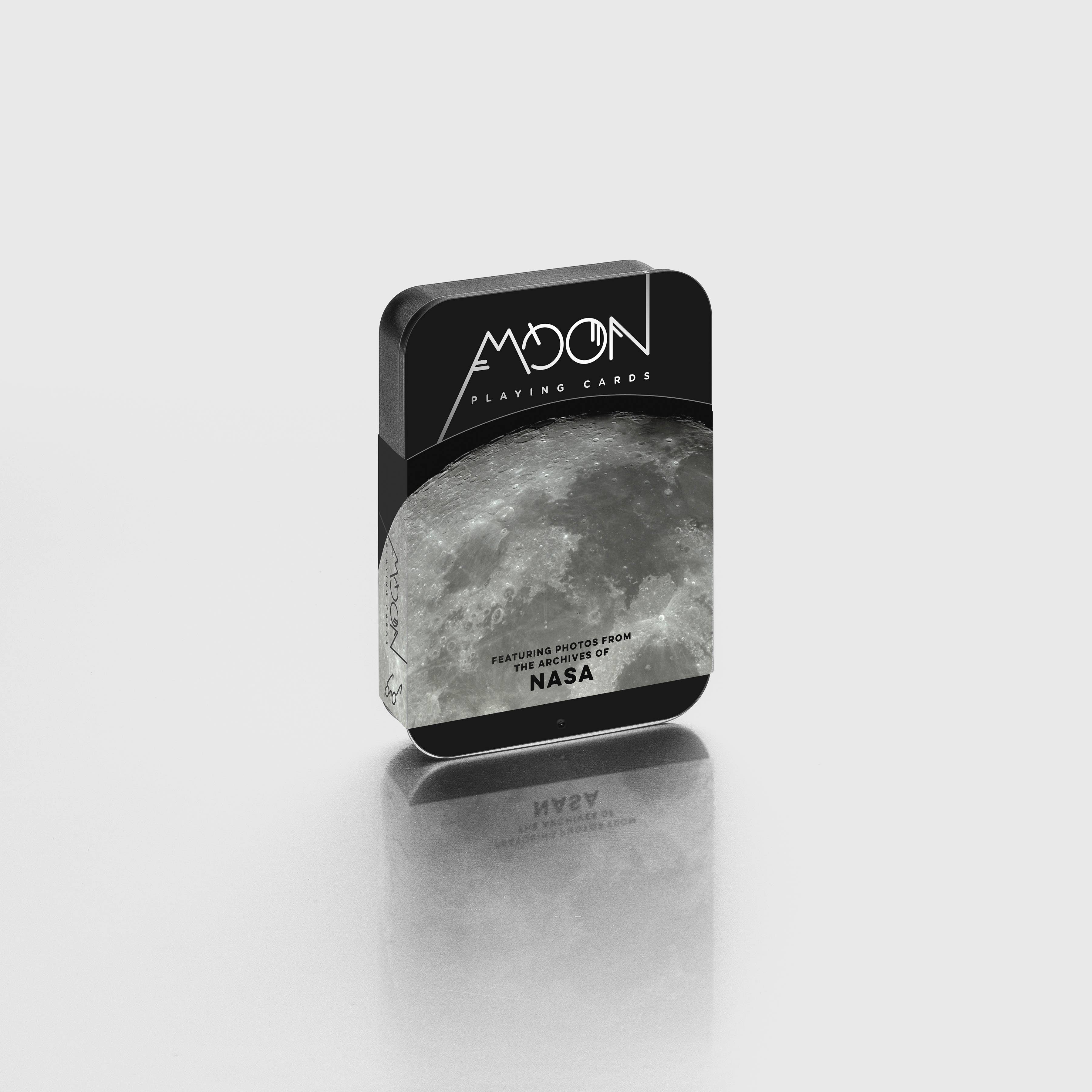 Moon playing cards packaging with NASA logo on a light gray background