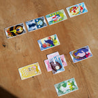 Colorful tarot cards on a wooden surface