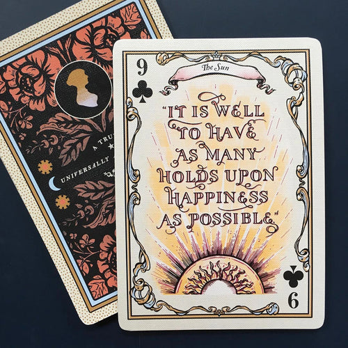 Playing card with decorative text and design on a dark background