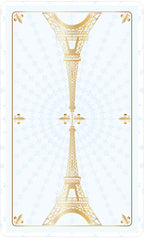 Gold Eiffel Tower design on a light blue background with decorative elements