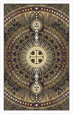 Decorative card with intricate gold and black designs, featuring symbols and patterns.